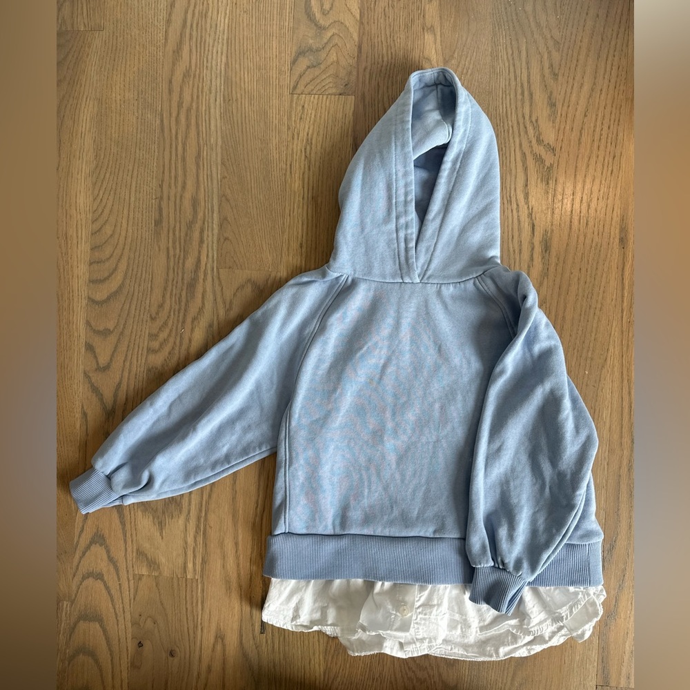 Girls blue hoodie with white button up hem
